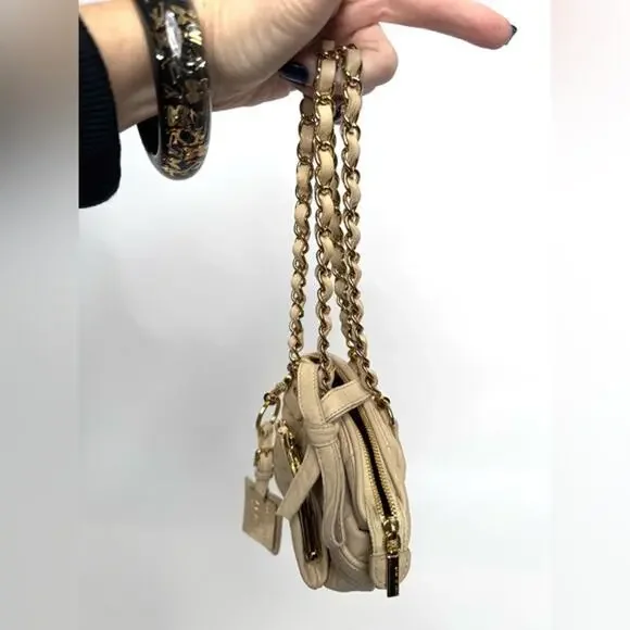 Dolce and Gabbana miniature leather bag with kiss lock, plaque and gold hardware